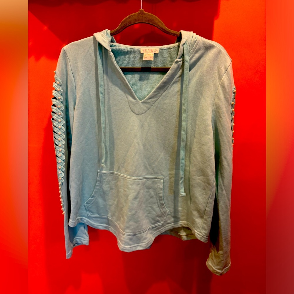 Turquoise hoodie with pearl embellished sleeves